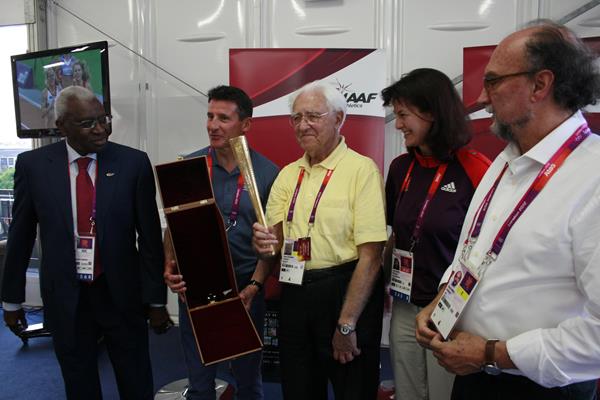 Gustav Schwenk is honoured at the London 2012 Games, the 15th summer Games he covered, at a ceremony involving the IAAF President Lamine Diack (left), LOCOG Chairman Sebastian Coe (second left), London 2012 Press Operations chief Jayne Pearce and Gianni Merlo, President of the AIPS ©IAAF