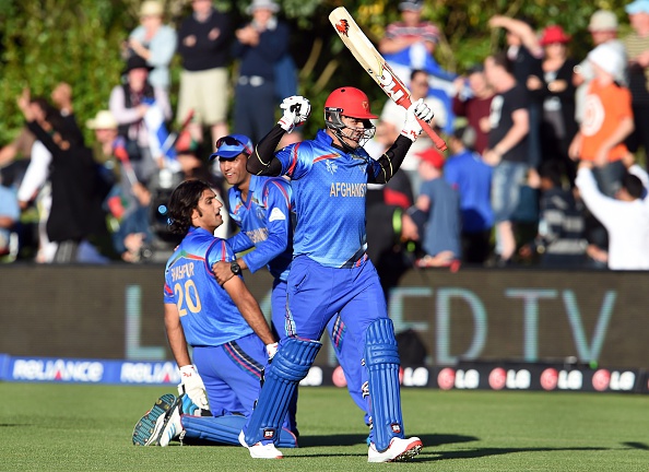 Afghanistan celebrate following their last ditch victory over Scotland ©AFP/Getty Images