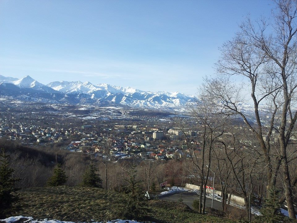 Almaty, including the mountains where events would be held during the Games, pictured from above the city ©ITG