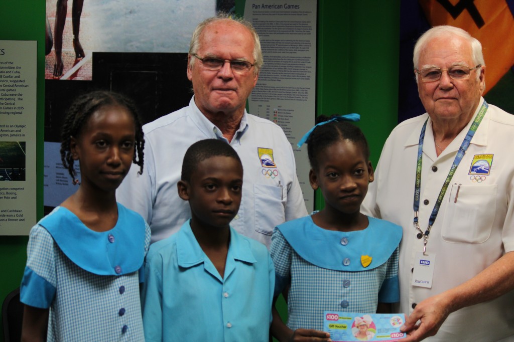 Dave Farmer, director of the National Olympic Academy of Barbados, and Steve Stoute, President of the BOA, with students of St. Lawrence Primary School at the launch of the art competition ©BOA