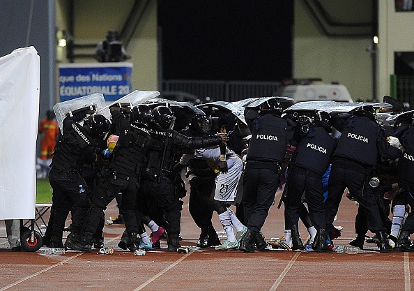 Ghana's players had to hide under police riot shields as they left the pitch for half-time as the Equatorial Guinea fans pelted them with missiles ©Getty Images