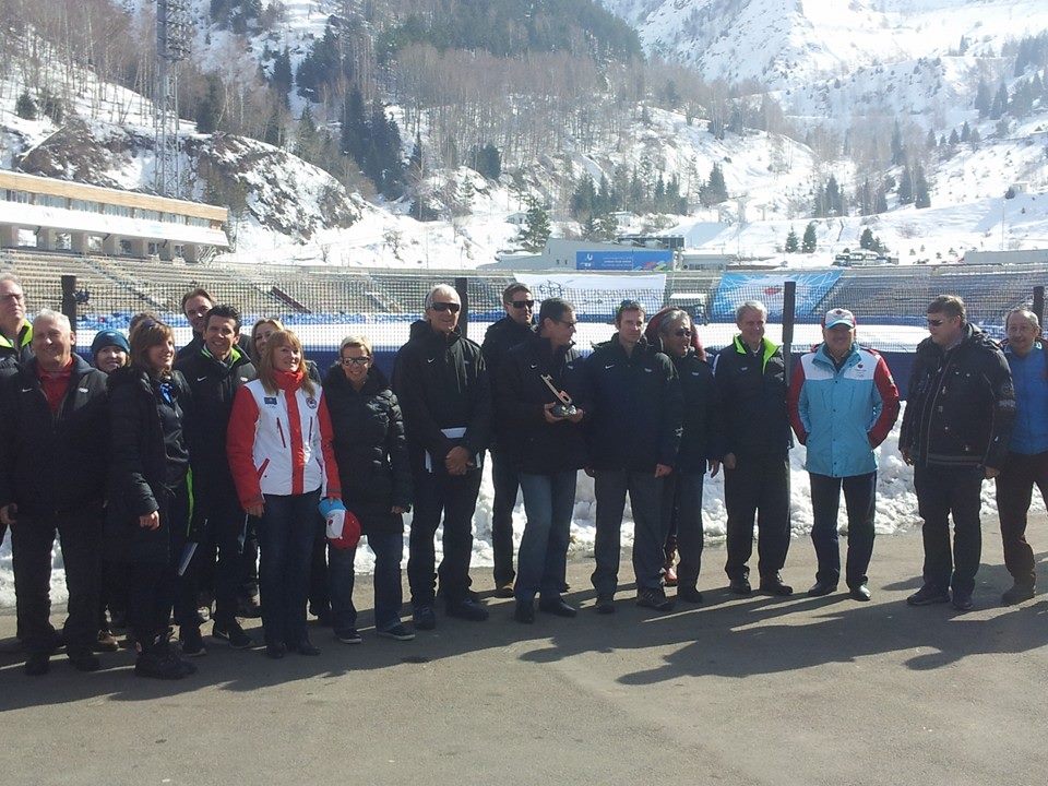 IOC Evaluation Commission and Almaty 2022 officials pose at the Medeu Skating Rink ©ITG