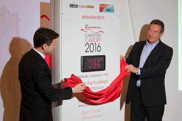 Lynn Davies (left), President of British Athletics, and Ken Skates (right), the Welsh Government's Deputy Minister for Culture Sport and Tourism, unveil the 2016 IAAF World Half Marathon Championships countdown clock ©IAAF