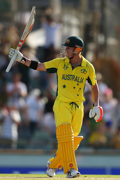 David Warner holds his bat aloft after producing another great innings against Afghanistan during Australia's Cricket World Cup in Perth ©Getty Images