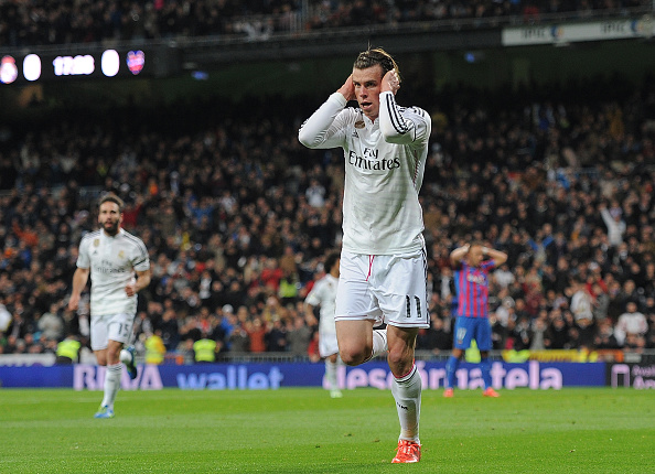 Under-fire Real Madrid striker Gareth Bale cups his ears after finally breaking his goal drought against Levante following criticism from both the fans and the media ©Getty Images