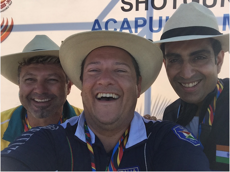 Massimo Fabbrizi (centre) celebrates his victory with silver medallist Michael Diamond (left) and bronze medallist Manavjit Singh Sandhu (right) ©ISSF