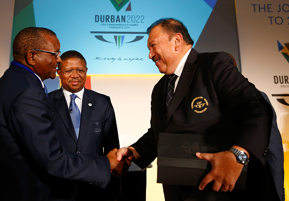 Prince Imran receieved Durban's bid book from Fikile Mbalula, South Africa's Minister for Sport ©Getty Images