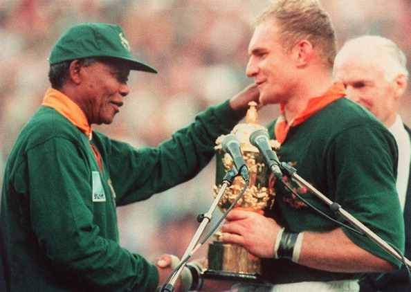 South African captain Francois Pienaar, pictured with the nation's former President Nelson Mandela, after the country won the 1995 World Cup on home turf ©AFP/Getty Images