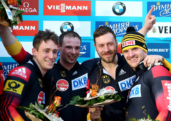 The German quartet celebrate their world title victory on home ice ©Bongarts/Getty Images