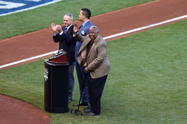 Robert Manfred, pictured last year (left) with Giancarlo Stanton of Miami Marlins and Hall-of-Famer Hank Aaron (right) before the fourth World Series game, has paid tribute to the leadership skills imbued in him at Cornell University under the tutorship of Professor Bacharach ©Getty Images