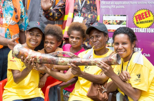 Vanimo residents hold the official Baton for the Pacific Games Relay ©Port Moresby 2015