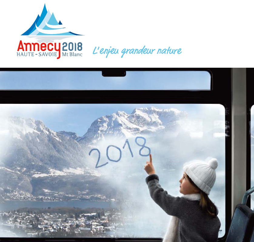 Annecy_2018_girl_on_train_with_mountains_in_background