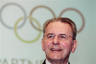 Jacques Rogge in front of Olympic rings July 2010(1)