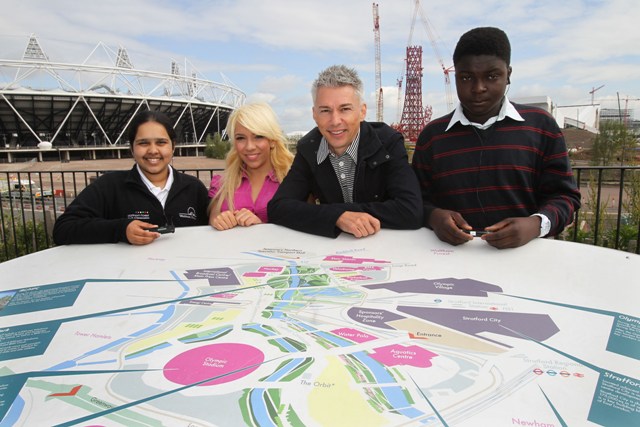 Jonathan_Edwards_at_Olympic_Stadium_with_youngsters_in_background_July_2011
