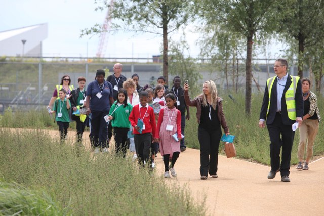 Olympic_Park_picnic_in_the_Park_people_walking_June_2011