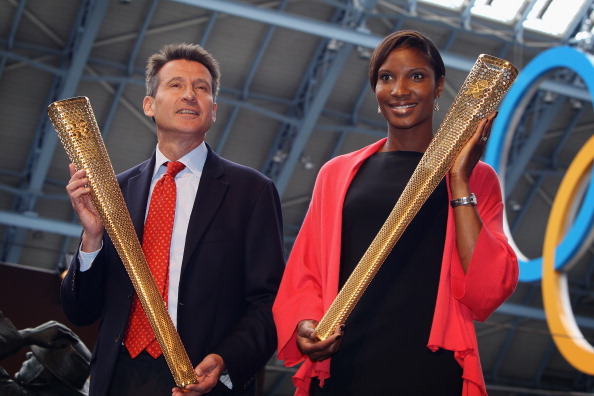 Sebastian_Coe_and_Denise_Lewis_with_Olympic_torch_St_Pancras_June_2011