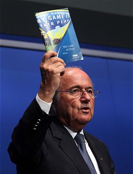 Sepp_Blatter_waving_FIFA_ethics_code_Zurich_May_30_2011