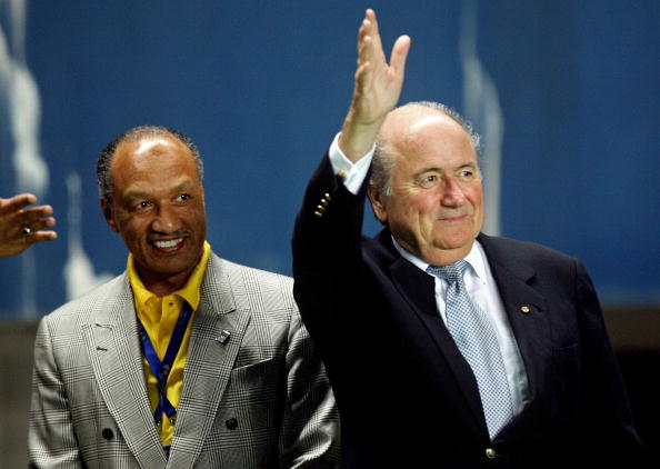 Sepp_Blatter_waving_with_Mohamed_Bin_Hammam