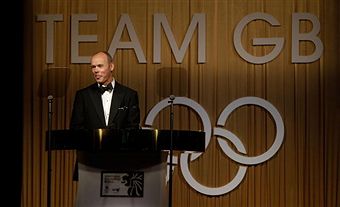Sir_Clive_Woodward_in_front_of_Team_GB_logo_September_2010