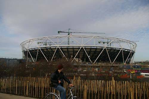 Olympic_Stadium_with_cyclist_going_past