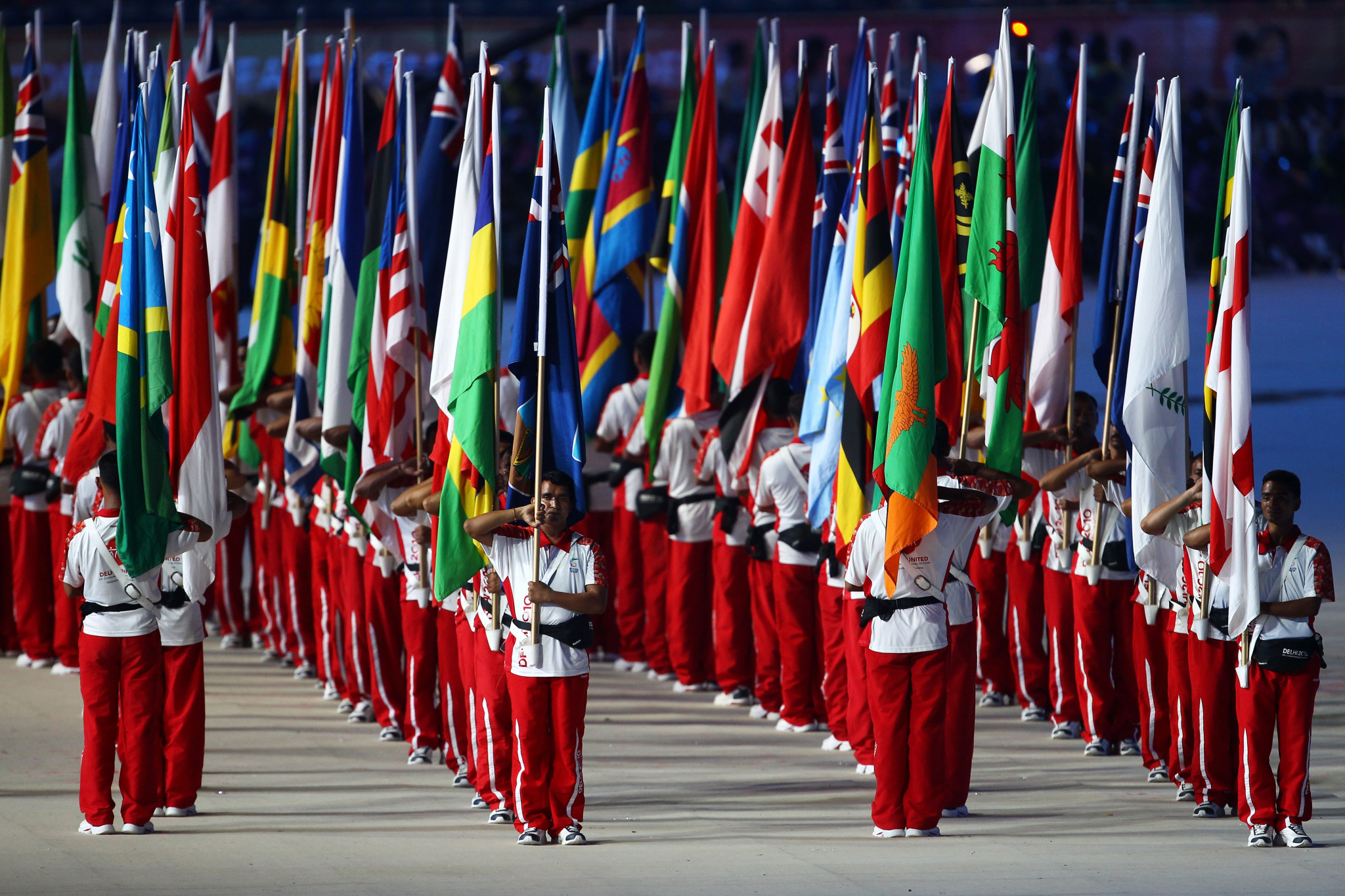 Flag bearers stand during the Opening Ceremony for the Delhi 2010 Commonwealth Games at Jawaharlal Nehru Stadium on October 3, 2010 in Delhi, India ©Getty Images