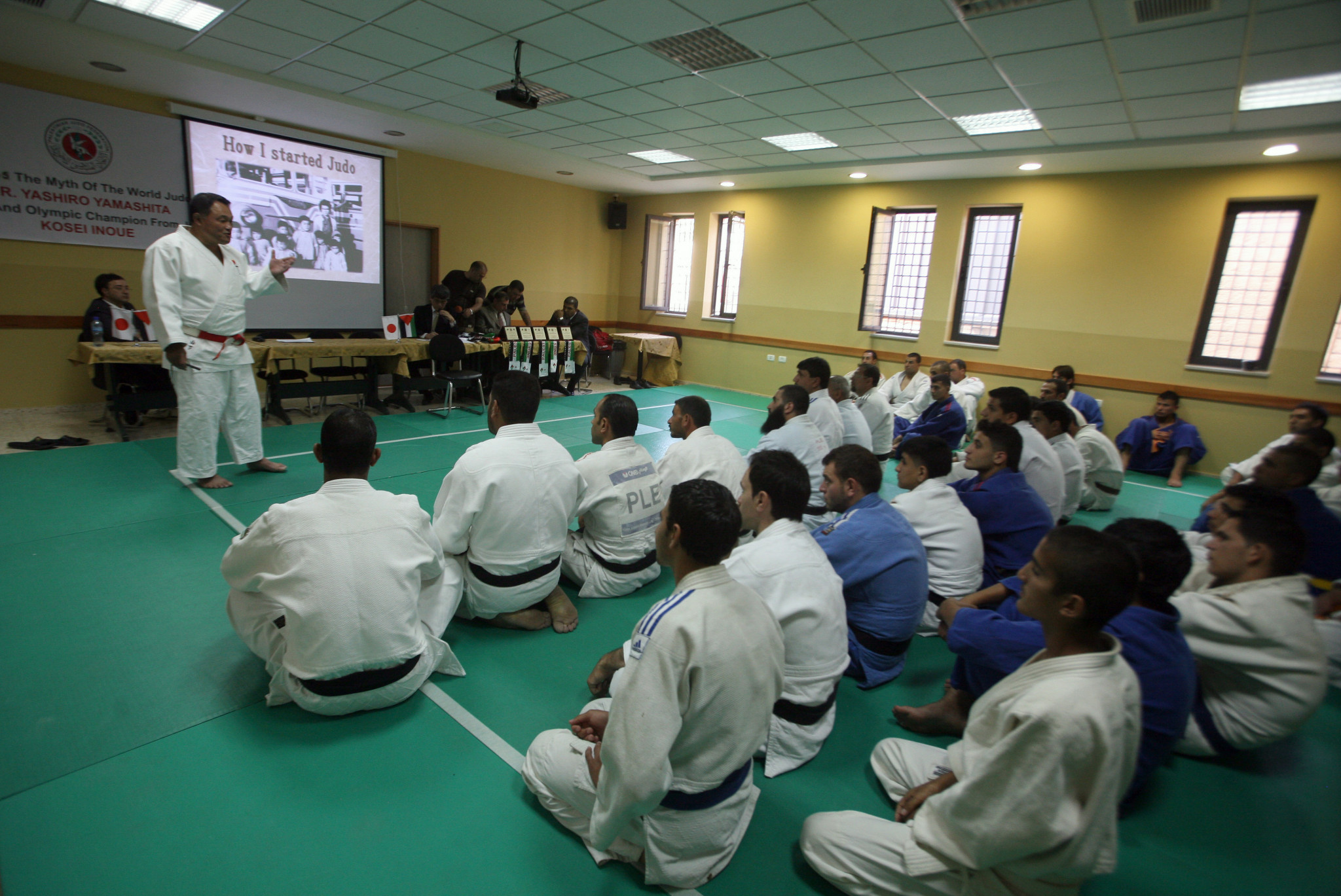 Japan's Yashiro Yamashita gives a lecture as he teaches Judo techniques to Palestinian students, members of the Judo Federation, in the biblical town of Bethlehem during his visit to the Israeli occupied Palestinian territories ©Getty Images