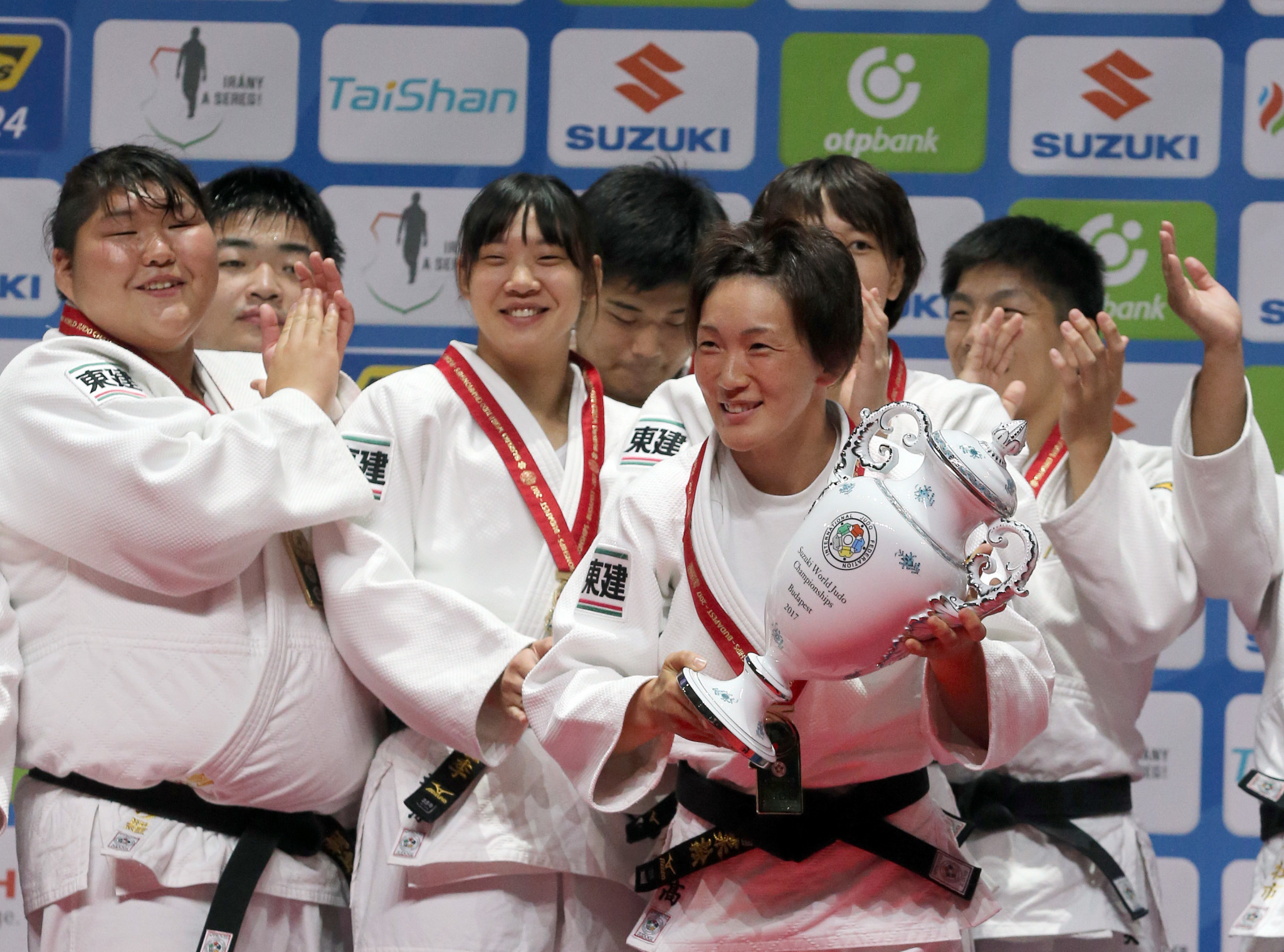 Gold winner Japan's team celebrates on the podium of the team event at the World Judo Championships in Budapest on September 3, 2017 ©Getty Images