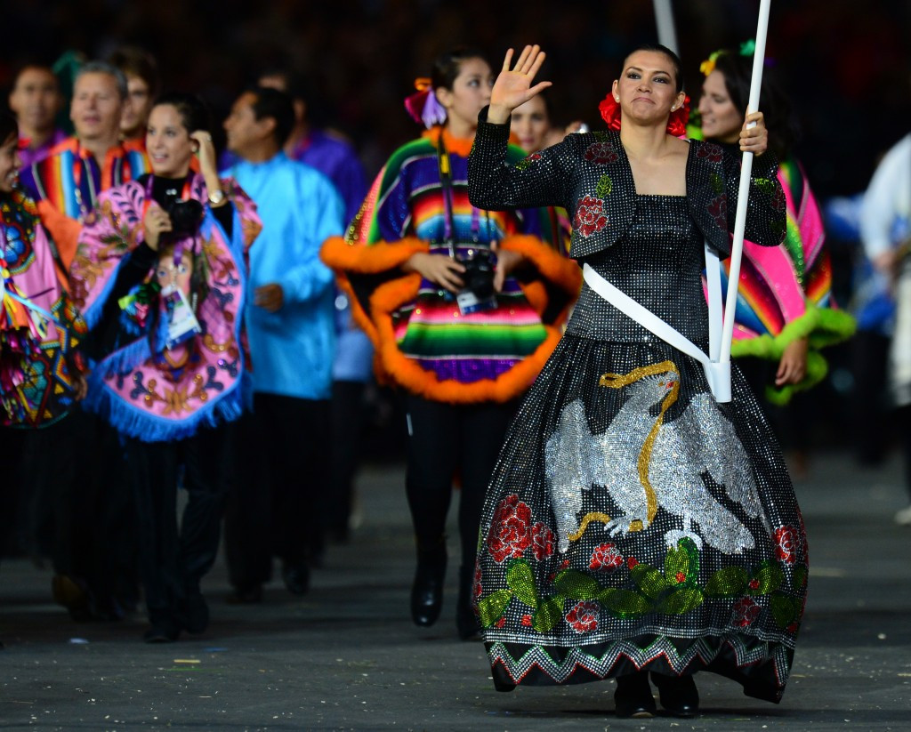 Maria Espinoza, pictured carrying the Mexican flag at the Opening Ceremony of London 2012, is a major star in her home country ©AFP/Getty Images